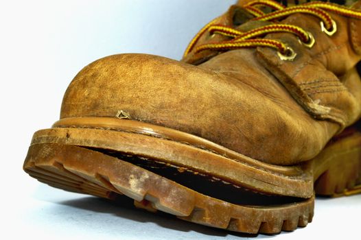 Illustration photo - Old broken shoe on a white background.