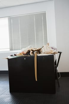 Desk with pile of fabric in college