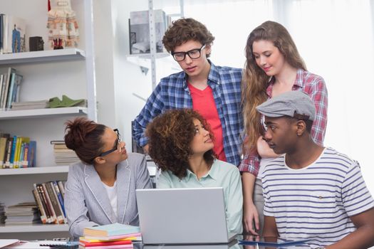 Fashion students working as a team  at the college