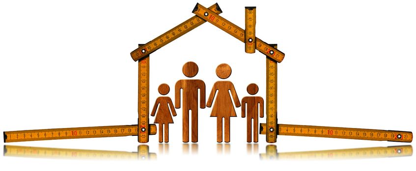 Yellow wooden meter ruler in the shape of house isolated on white background with symbol of a family. House project concept.
