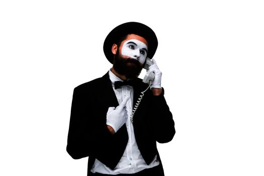 man in the image mime holding a handset isolated on white background. 