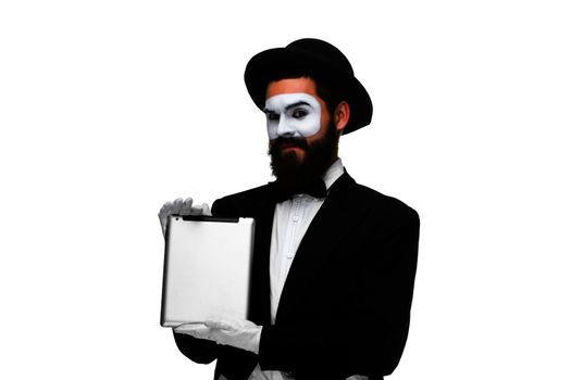 Man with a face mime working on a laptop isolated on a white background. concept of presentation in business