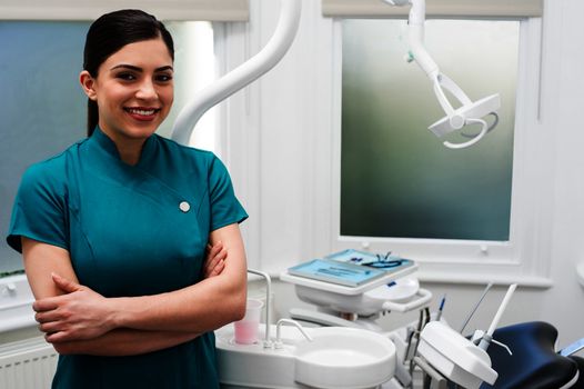 Confident female dental assistant posing 