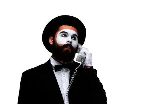 man in the image mime holding a handset isolated on white background. The concept -  submission