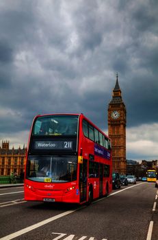 LONDON - APRIL 4: Iconic red double decker bus on April 4, 2015 in London, UK. The London Bus is one of London's principal icons, the archetypal red rear-entrance Routemaster being recognised worldwide.