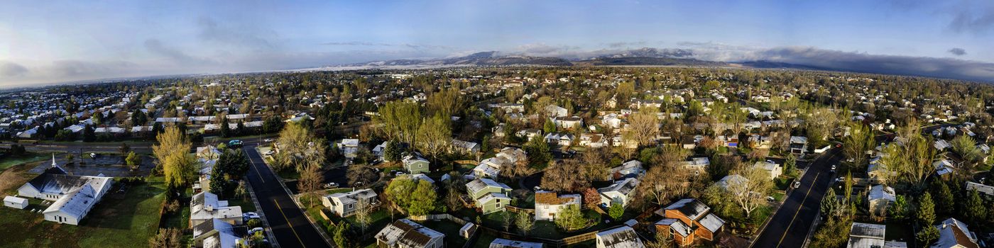 FORT COLLINS, CO, USA - APRIL 20 2015: Aerial panorama of Fort Collins, a typical residential neighborhood along Front Range of Rocky Mountains in Colorado,  early spring with some snow