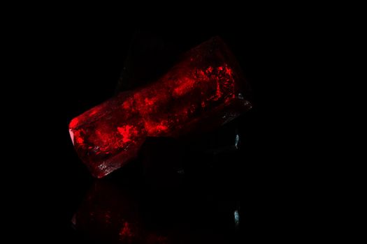 A macro photo of red glowing crystals.