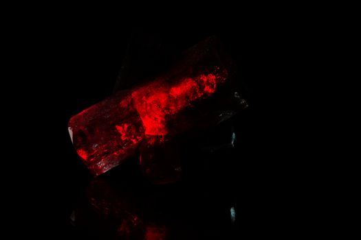 A macro photo of red glowing crystals.