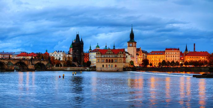 The Old Town with Charles bridge tower in Prague in the evening