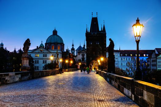 PRAGUE - OCTOBER 17: Charles bridge in the morning on October 17, 2014 in Prague. This famous historic bridge crosses the Vltava river and was constructed in the beginning of the 15th century.