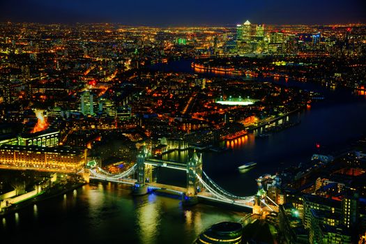 Aerial overview of London city with the Tower bridge at the night time