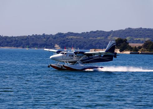 seaplane landing on sea surface 