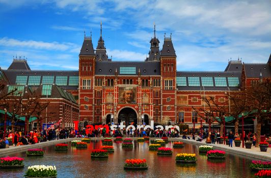 AMSTERDAM - APRIL 16: I Amsterdam slogan with crowd of tourists on April 16, 2015 in Amsterdam. Located at the back of the Rijksmuseum on Museumplein, the slogan quickly became a city icon.