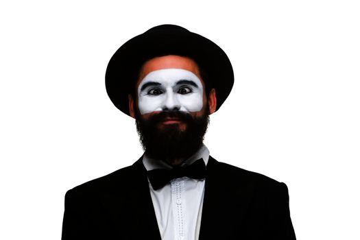 Portrait of the surprised mime with squinting eyes isolated on white background. Concept of wonder and expectation