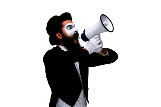 Man  with a face mime screaming into a megaphone, isolated on white background. concept of effective communication
