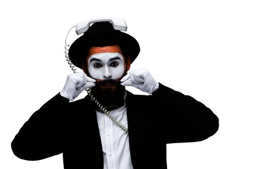 man in the image mime holding a handset isolated on white background. The concept -  I'm always in touch