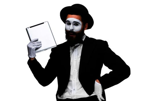 Man with a face mime working on a laptop isolated on a white background. concept of fatigue in business