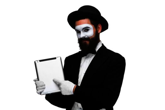 Man with a face mime working on a laptop isolated on a white background. concept of presentation in business
