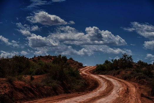 curved uphill desert dirt road