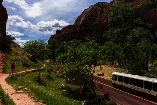 shuttle bus and teenage girl on walking trail