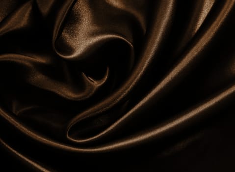 Smooth elegant golden silk or satin can use as background. In Sepia toned. Retro style