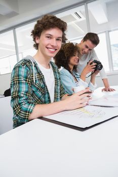 Students working with picture and camera at the college