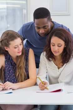 Students working together in class at the college