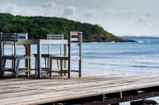 Wood dock White chair and table in Koh Samet Thailand