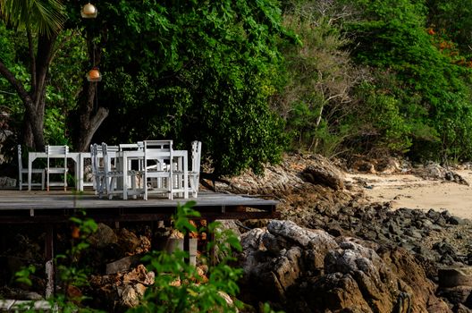 Wood dock White chair and table in Koh Samet Thailand