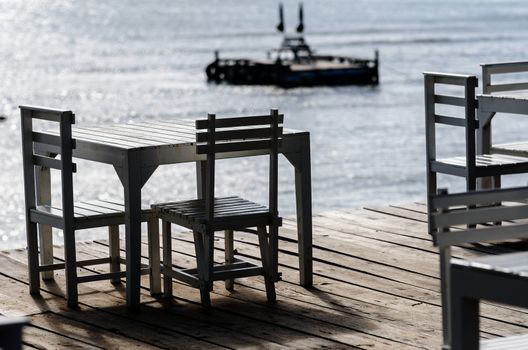 Wood dock White chair and table in Koh Samet Thailand