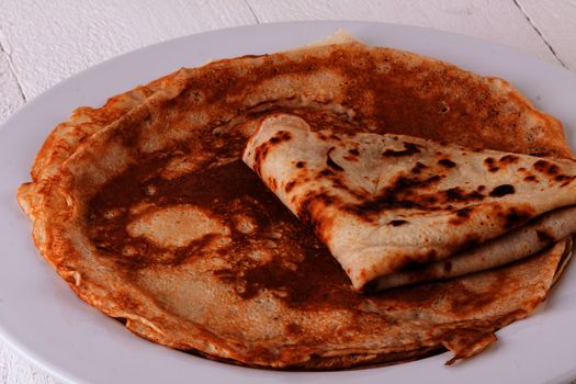 Delicious Pancakes on Plate Served, Isolated on White Wooden Table