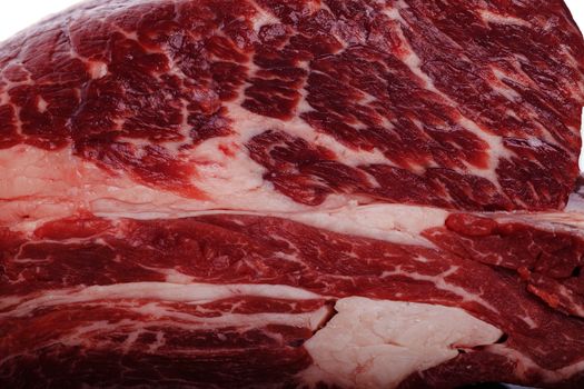 Fresh Slice of Protein Rich Raw Beef Meat on Top of the Table on White Background