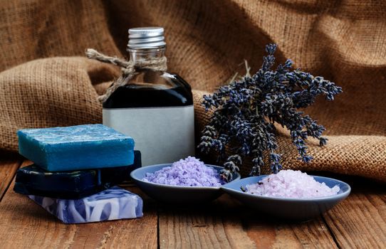 Homemade Soap with Lavender Flowers and Sea Salt, on wooden background
