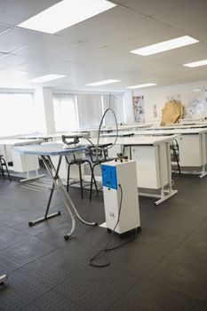 Empty class room with ironing board in college