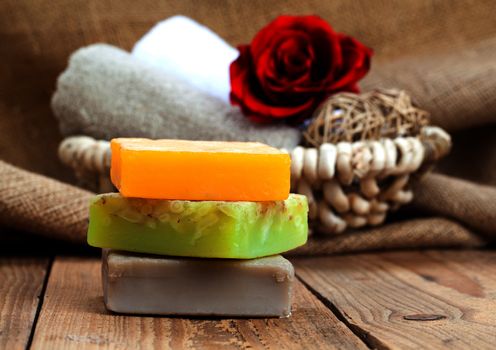 colorful handmade soap bars, on wooden background