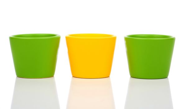 group of empty ceramic flower pots, isolated on white background