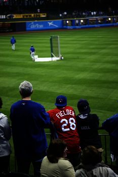 Fans watch batting practice at Miller Park before a Brewers game against the Chicago Cubs.