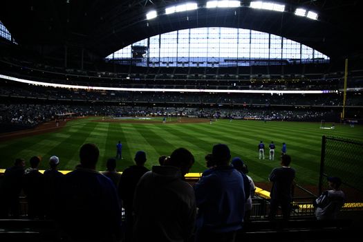 Brewers fans await a baseball game at Miller Park against the Chicago Cubs under a closed dome .