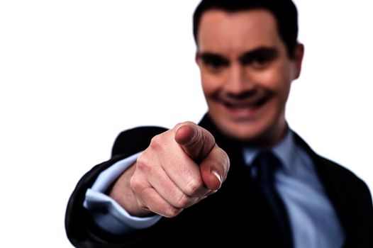 Businessman pointing his finger towards camera