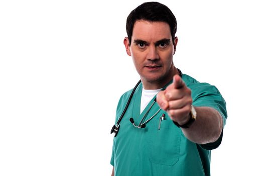 Frustrated male physician pointing his finger to camera