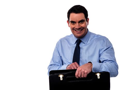 Smiling male executive with black leather bag