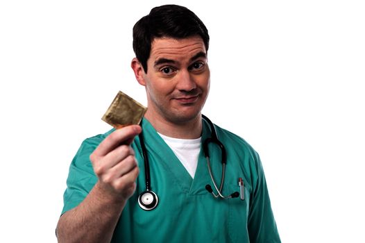 Male doctor showing condoms for aids prevention