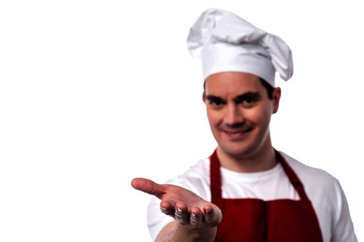 Happy male chef showing his palm to camera 