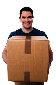 Casual smiling man delivering  cardboard box
