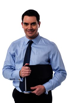 Smiling male executive holding a black folder