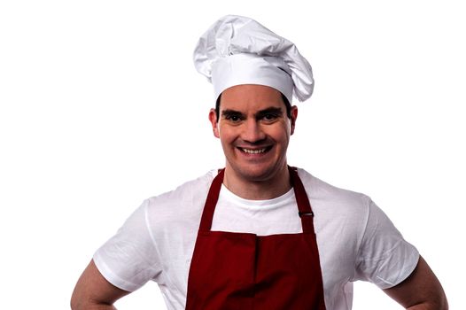 Male chef smiling and looking at the camera