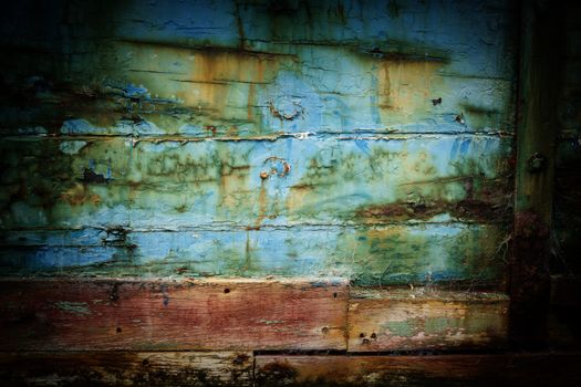 Abstract closeup of old abandoned ships hull, veteran flat-bottomed scow “Portland”moored in the Owaka River