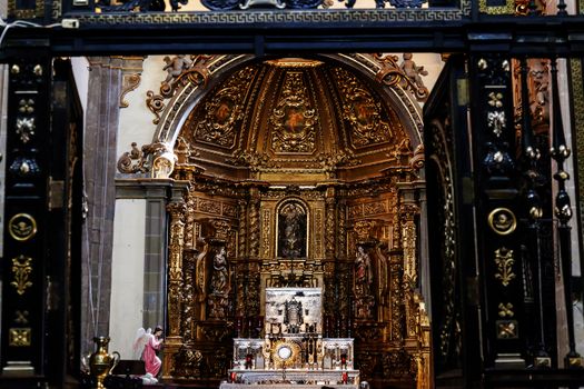 Small Chapel Altar Old Basilica Shrine of Guadalupe Mexico City Mexico. Also known as Templo Expiatorio a Cristo Rey.  Basilica construction was started in 1531, finished in 1709.  This is the basilica is the location where the Virgin Mary appeared to the Meixcan peasant Juan Diego.  The old Basilica is where Juan Diego's original cloak with the picture of the Virgin Mary first appeared. 