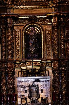 Small Chapel Altar Old Basilica Shrine of Guadalupe Mexico City Mexico. Also known as Templo Expiatorio a Cristo Rey.  Basilica construction was started in 1531, finished in 1709.  This is the basilica is the location where the Virgin Mary appeared to the Meixcan peasant Juan Diego.  The old Basilica is where Juan Diego's original cloak with the picture of the Virgin Mary first appeared.