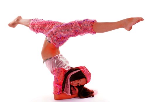 Young Girl Standing on Hands and Do Splits in Pink Oriental Costume on white background